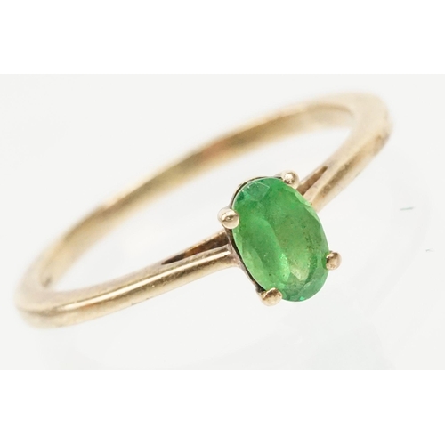 247 - 9ct gold Tsavorite garnet ring. The ring being set with an oval cut tsavorite garnet in a four prong... 