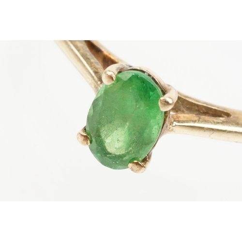 247 - 9ct gold Tsavorite garnet ring. The ring being set with an oval cut tsavorite garnet in a four prong... 