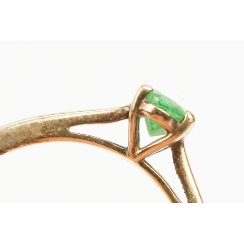 247 - 9ct gold Tsavorite garnet ring. The ring being set with an oval cut tsavorite garnet in a four prong... 