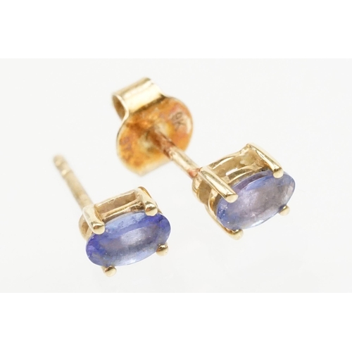 250 - Four pairs of 9ct gold earrings to include a pair of tanzanite drop earrings, a pair of tanzanite st... 