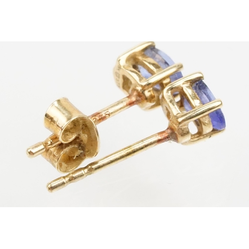 250 - Four pairs of 9ct gold earrings to include a pair of tanzanite drop earrings, a pair of tanzanite st... 