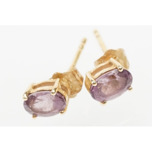 250 - Four pairs of 9ct gold earrings to include a pair of tanzanite drop earrings, a pair of tanzanite st... 