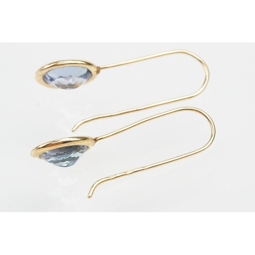 250 - Four pairs of 9ct gold earrings to include a pair of tanzanite drop earrings, a pair of tanzanite st... 