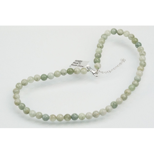 255 - Jade beaded necklace with silver clasp together with two collections of smaller jade beads mounted o... 