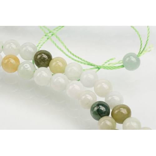 255 - Jade beaded necklace with silver clasp together with two collections of smaller jade beads mounted o... 