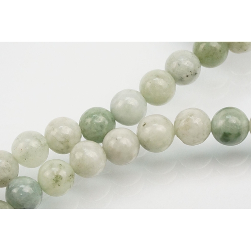 255 - Jade beaded necklace with silver clasp together with two collections of smaller jade beads mounted o... 