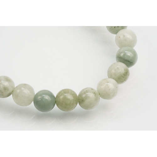 255 - Jade beaded necklace with silver clasp together with two collections of smaller jade beads mounted o... 