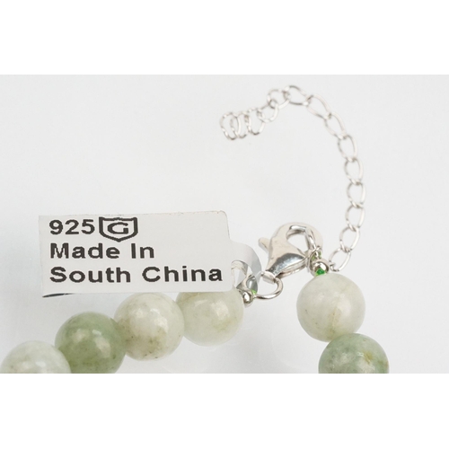 255 - Jade beaded necklace with silver clasp together with two collections of smaller jade beads mounted o... 