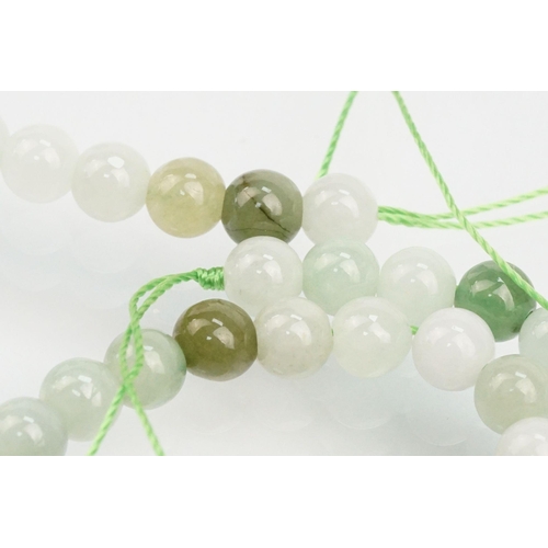 255 - Jade beaded necklace with silver clasp together with two collections of smaller jade beads mounted o... 