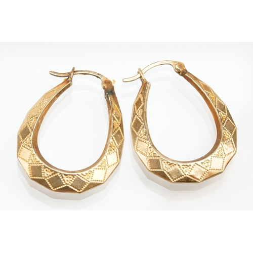 265 - Four pairs of 9ct gold hoop earrings including two tone examples. All marked 375. Largest measures 2... 