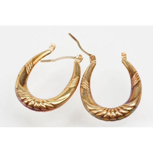 265 - Four pairs of 9ct gold hoop earrings including two tone examples. All marked 375. Largest measures 2... 