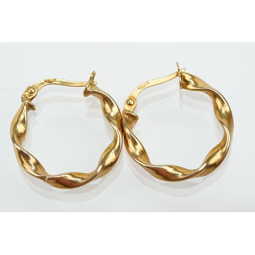 268 - Three pairs of 9ct gold hoop earrings to include a twist design hoops, two tone twist hoops and a pa... 