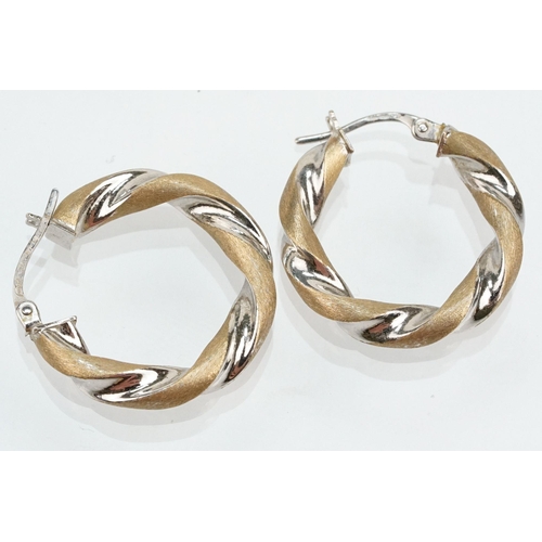 268 - Three pairs of 9ct gold hoop earrings to include a twist design hoops, two tone twist hoops and a pa... 