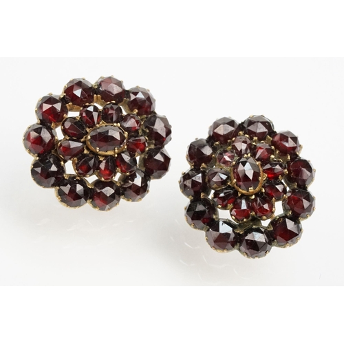 269 - Pair of 19th Century Victorian garnet cluster earrings in yellow metal mounted with hook fastenings.... 