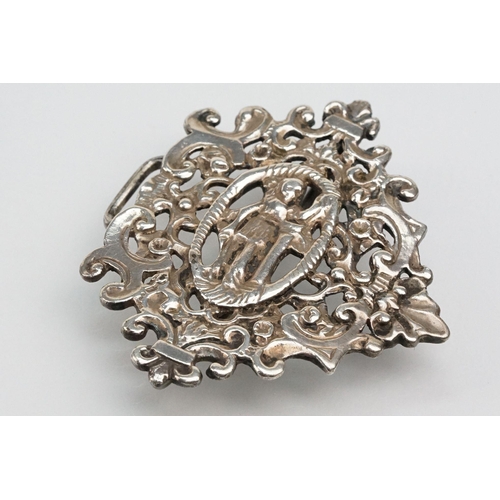 271 - Two silver nurses belt buckles to include an example featuring classical cherubs with grape vines an... 