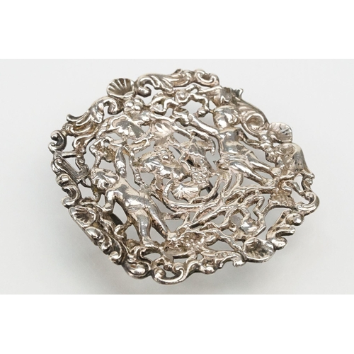 271 - Two silver nurses belt buckles to include an example featuring classical cherubs with grape vines an... 