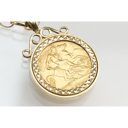 272 - 1913 half sovereign coin pendant set within a 9ct gold mount on a 9ct spectacle chain. Mount hallmar... 