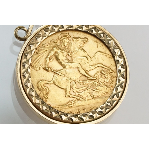 272 - 1913 half sovereign coin pendant set within a 9ct gold mount on a 9ct spectacle chain. Mount hallmar... 