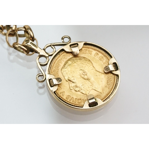 272 - 1913 half sovereign coin pendant set within a 9ct gold mount on a 9ct spectacle chain. Mount hallmar... 