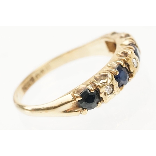 274 - 9ct gold sapphire and diamond ring. The ring being set with four round cut sapphires with diamond ac... 