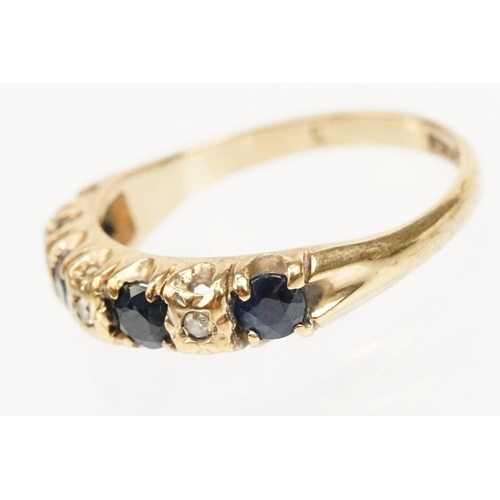 274 - 9ct gold sapphire and diamond ring. The ring being set with four round cut sapphires with diamond ac... 