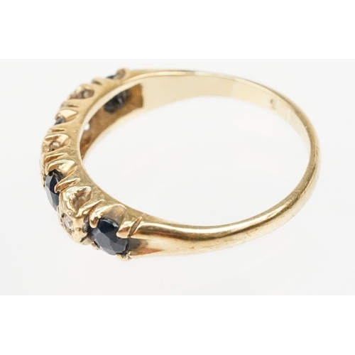 274 - 9ct gold sapphire and diamond ring. The ring being set with four round cut sapphires with diamond ac... 