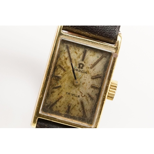 279 - Omega De Ville 18ct gold case ladies wrist watch having a rectangular face with baton markers to the... 