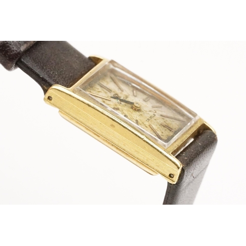 279 - Omega De Ville 18ct gold case ladies wrist watch having a rectangular face with baton markers to the... 