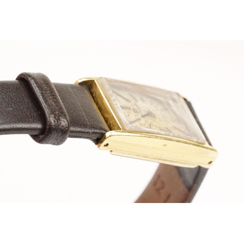 279 - Omega De Ville 18ct gold case ladies wrist watch having a rectangular face with baton markers to the... 