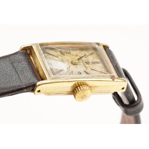 279 - Omega De Ville 18ct gold case ladies wrist watch having a rectangular face with baton markers to the... 