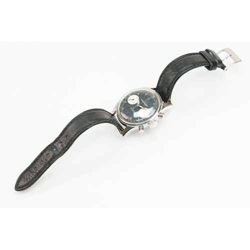 282 - Landeron Chronosport vintage wrist watch. The watch having a black face with silver baton markers to... 