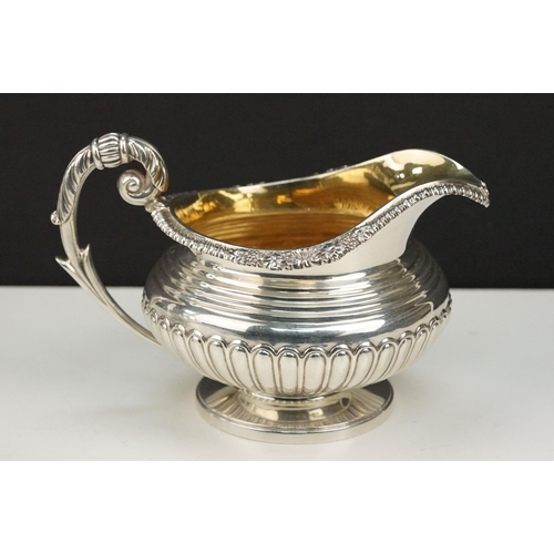 342 - 19th Century William IV silver hallmarked matching sugar bowl and cream jug. Each having gadrooned b... 