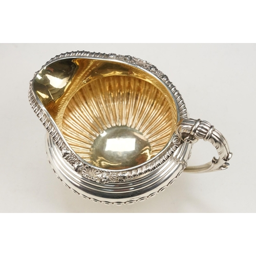 342 - 19th Century William IV silver hallmarked matching sugar bowl and cream jug. Each having gadrooned b... 