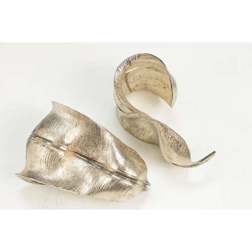 345 - Pair of Garrard & Co silver napkin rings in the form of feathers (hallmarked London 1969) together w... 