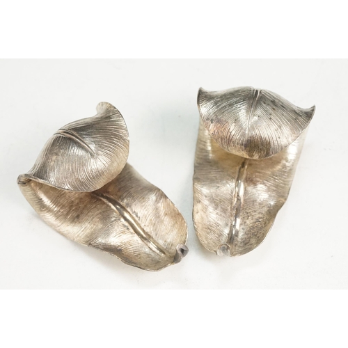 345 - Pair of Garrard & Co silver napkin rings in the form of feathers (hallmarked London 1969) together w... 