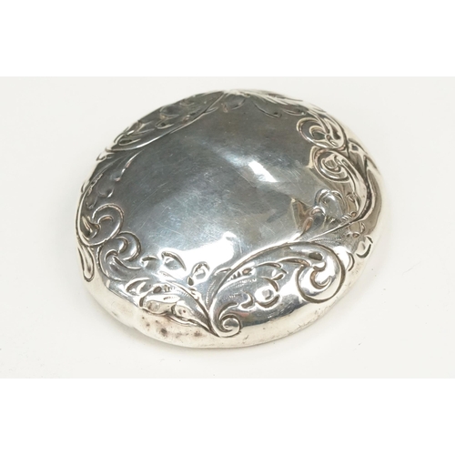 360 - Collection of silver items to include an egg cup, small chamberstick, napkin ring, and jar lid. All ... 