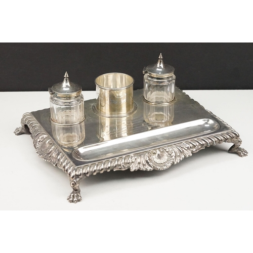 361 - Early 20th Century silver hallmarked ink stand having a silver base with gadrooned borders raised on... 