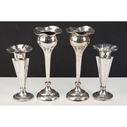 367 - Two pairs of silver hallmarked stem vases each with tapering stems on pedestal bases. Larger pair ha... 