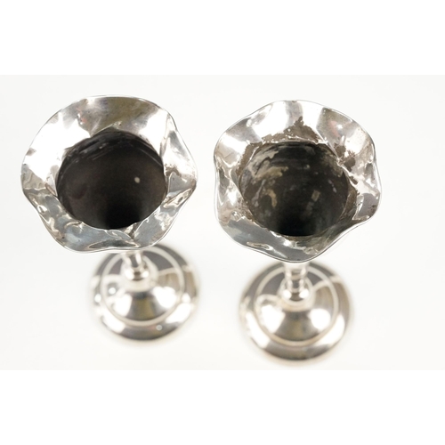 367 - Two pairs of silver hallmarked stem vases each with tapering stems on pedestal bases. Larger pair ha... 