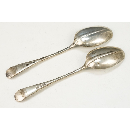 369 - Pair of early 20th Century silver hallmarked spoons with rounded terminals and engraved crests to ha... 