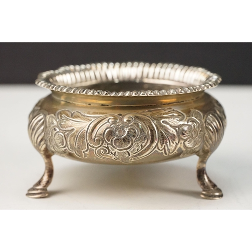 371 - Pair of 19th Century Victorian silver hallmarked table salts having floral details raised on hoof fe... 