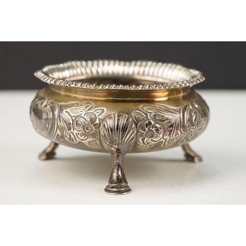 371 - Pair of 19th Century Victorian silver hallmarked table salts having floral details raised on hoof fe... 