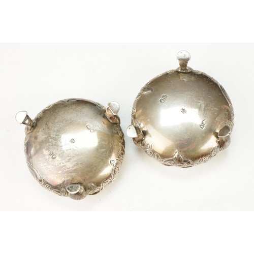 371 - Pair of 19th Century Victorian silver hallmarked table salts having floral details raised on hoof fe... 