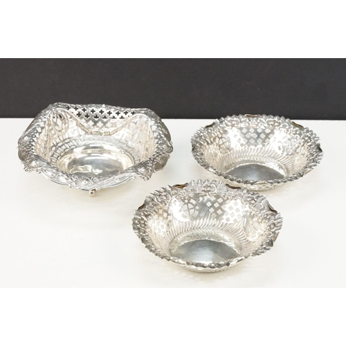 377 - Group of silver dishes to include a pair of round dishes with pierced details (hallmarked 1902, Adie... 