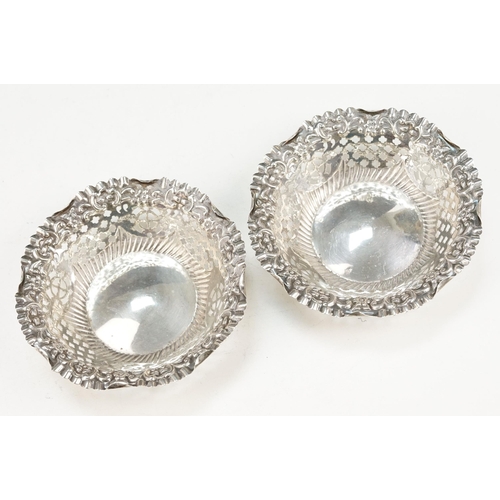 377 - Group of silver dishes to include a pair of round dishes with pierced details (hallmarked 1902, Adie... 