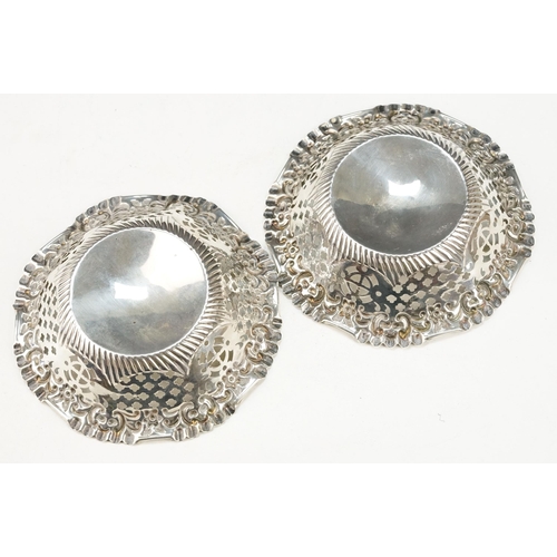 377 - Group of silver dishes to include a pair of round dishes with pierced details (hallmarked 1902, Adie... 