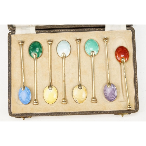 385 - Set of mid 20th Century silver and enamel teaspoons. The spoons having shell backs with coloured ena... 