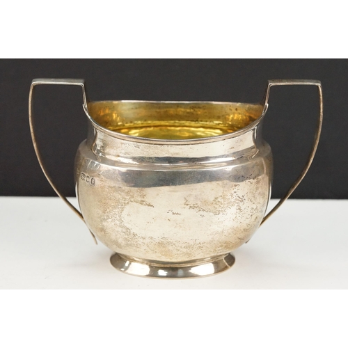 388 - 1920s silver hallmarked twin handled sugar bowl having a gilt interior with two stirrup handles. Hal... 