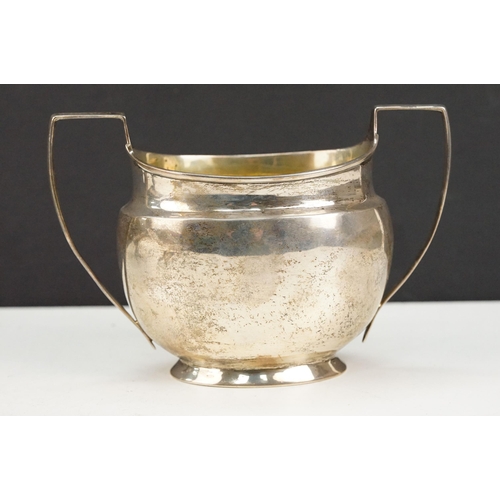 388 - 1920s silver hallmarked twin handled sugar bowl having a gilt interior with two stirrup handles. Hal... 