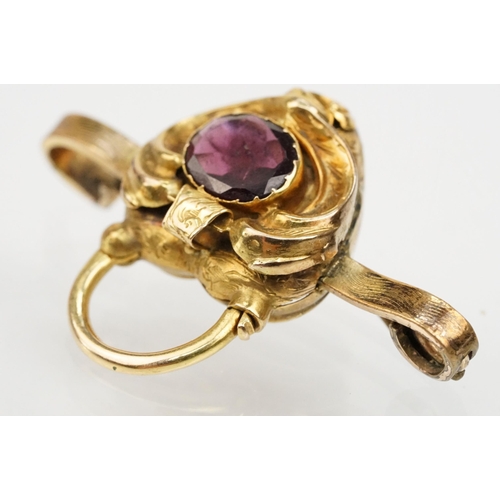 4 - 19th Century Victorian garnet bar brooch. The brooch having a padlock to centre set with an oval cut... 